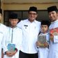 Wakil Bupati Garut, dr. Helmi Budiman, ptp bersama dengan beberapa kafilah kegiatan STQ tingkat Kabupaten Garut Tahun 2022 yang dilaksanakan di Aula Islamic Center Garut, Kecamatan Garut Kota, Kabupaten Garut, Rabu (28/9/2022). 