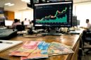 Ilustrasi pergerakan nilai tukar rupiah terhadap dolar AS.
