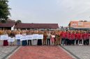 Penyerahan simbolis manfaat Jaminan Kematian kepada ahli waris peserta BPJS Ketenagakerjaan dalam apel gabungan di Kabupaten Garut, 12 Oktober 2026.