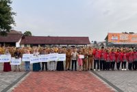 Penyerahan simbolis manfaat Jaminan Kematian kepada ahli waris peserta BPJS Ketenagakerjaan dalam apel gabungan di Kabupaten Garut, 12 Oktober 2026.