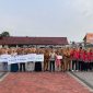 Penyerahan simbolis manfaat Jaminan Kematian kepada ahli waris peserta BPJS Ketenagakerjaan dalam apel gabungan di Kabupaten Garut, 12 Oktober 2026.